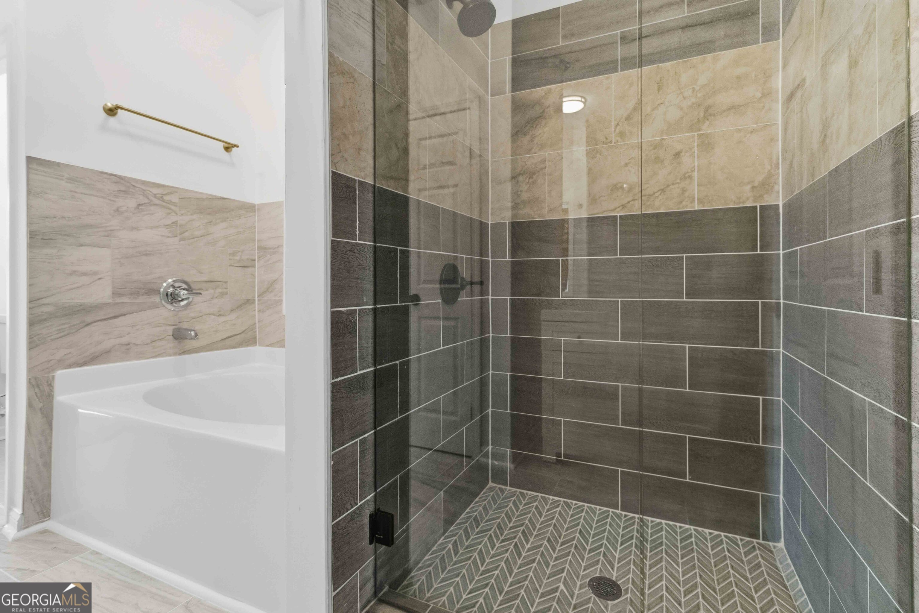 6938 Shadow Ridge Lane Stone Mountain, GA 30087 - Photo 13 of 27 a bathroom with a bathtub