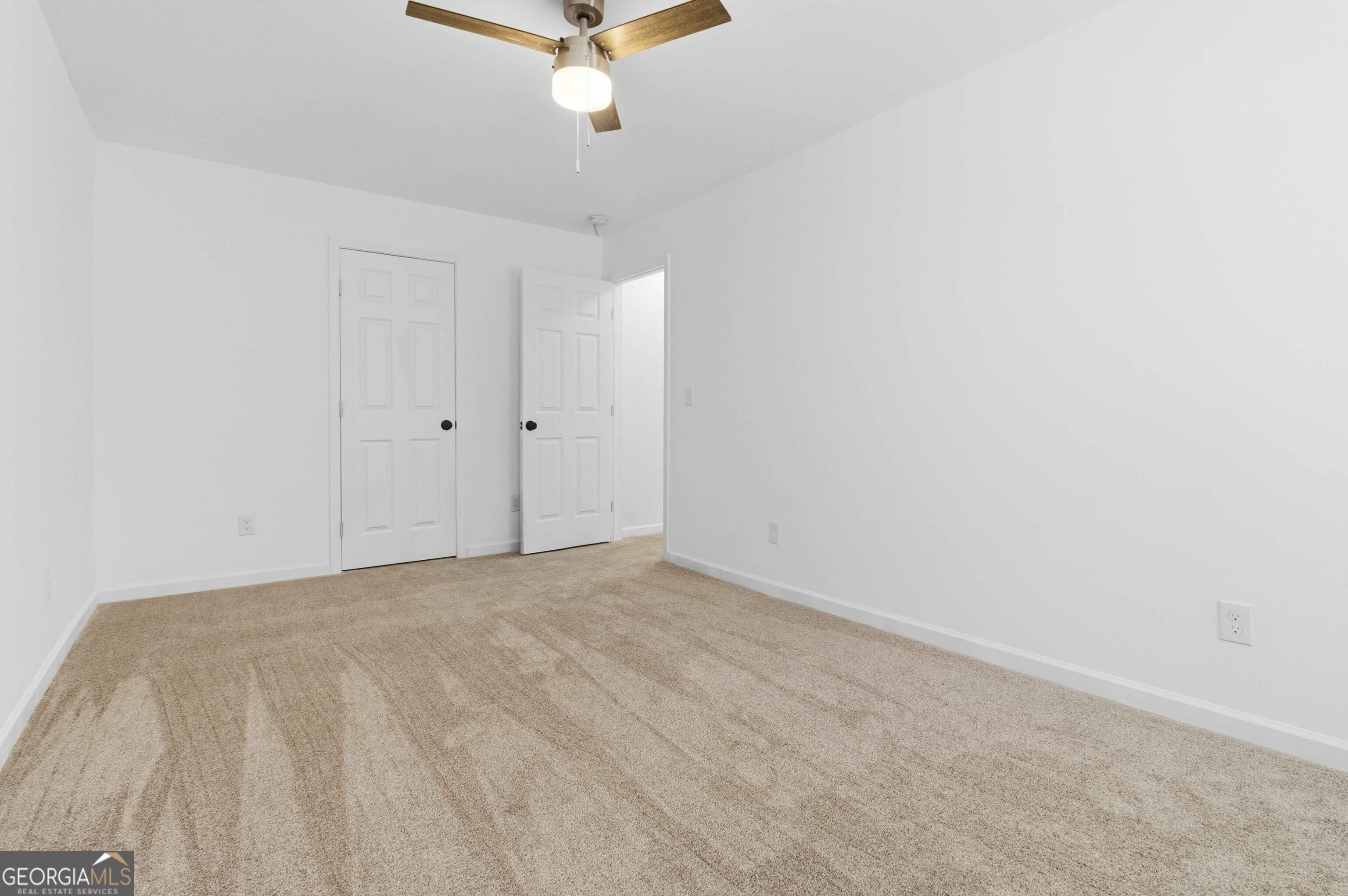 6938 Shadow Ridge Lane Stone Mountain, GA 30087 - Photo 21 of 27 a view of a room with a fan