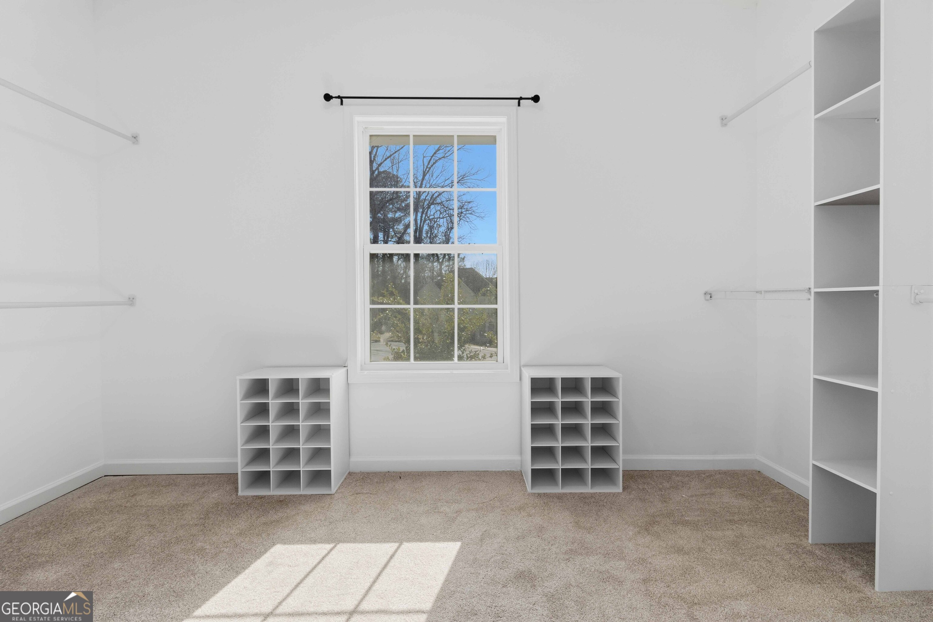 6938 Shadow Ridge Lane Stone Mountain, GA 30087 - Photo 24 of 27 an empty room with a window