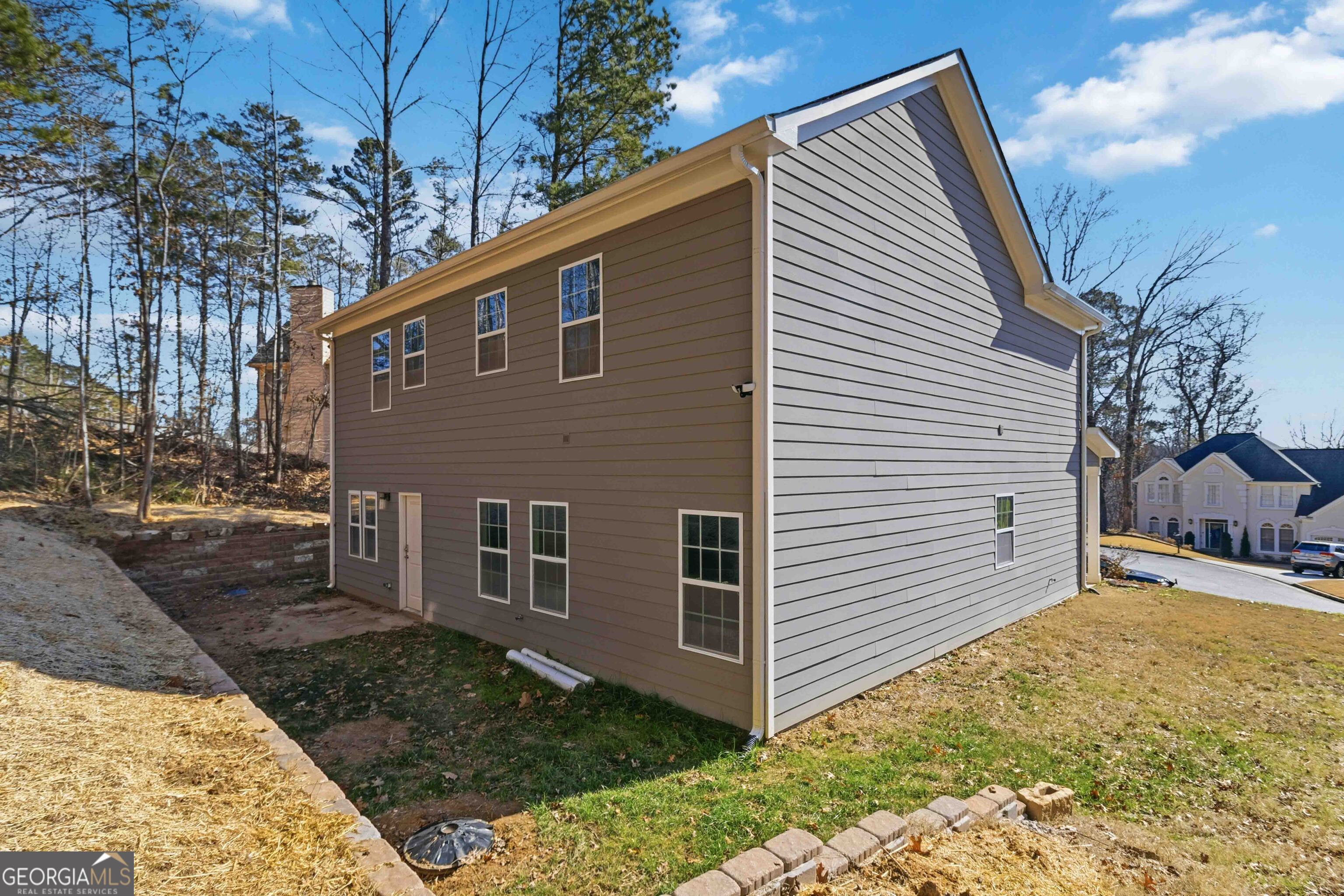 6938 Shadow Ridge Lane Stone Mountain, GA 30087 - Photo 27 of 27 a view of a house with a yard