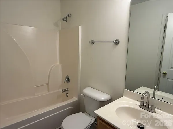 a bathroom with a sink toilet and a bathtub