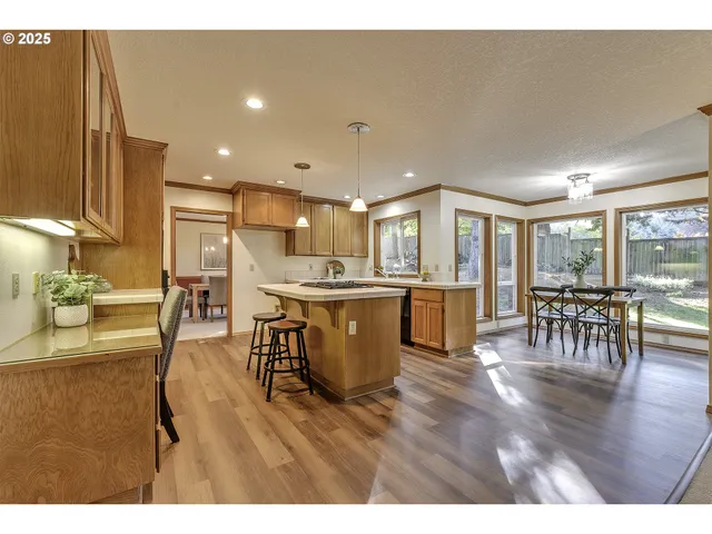 a living room with stainless steel appliances kitchen island granite countertop furniture and a kitchen view