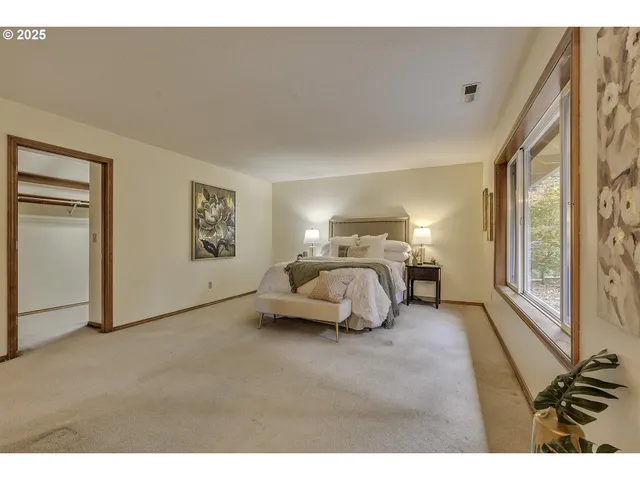a bedroom with furniture and a window