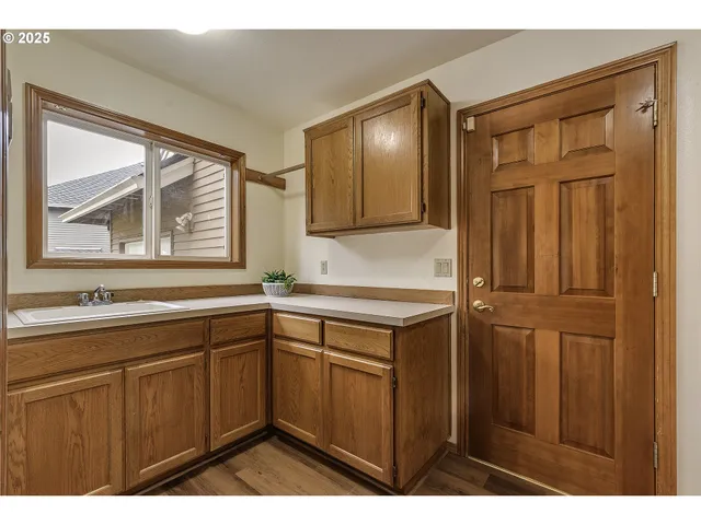a kitchen with a sink and cabinets