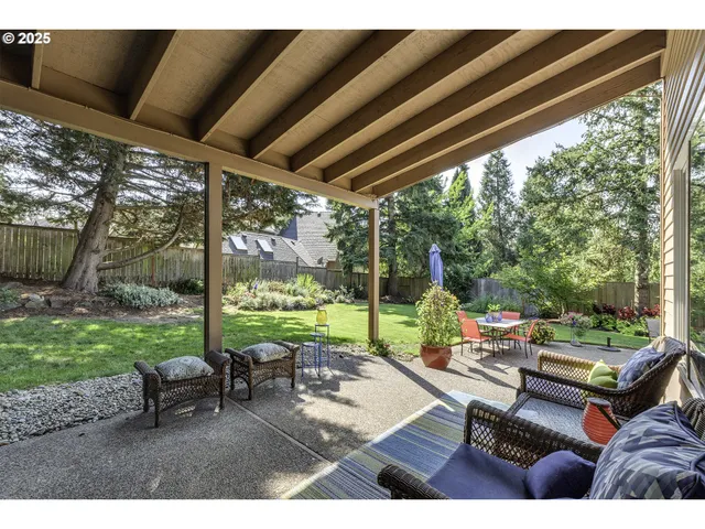 a view of a patio with couches chairs dining table and chairs