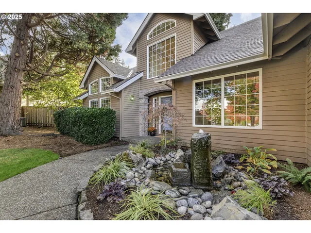 a front view of a house with garden