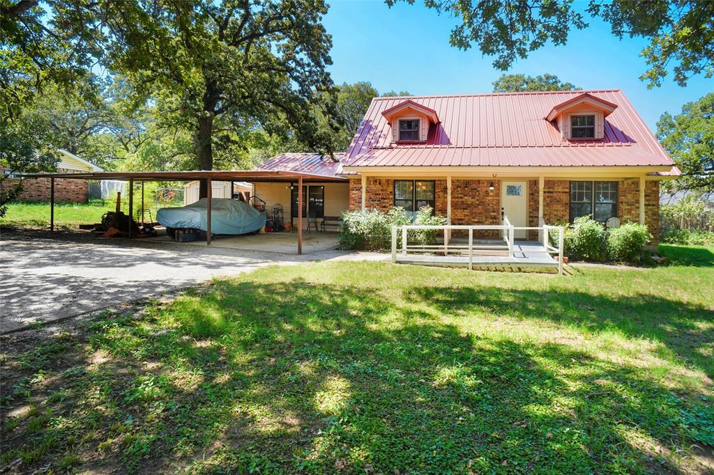 a view of a house with a yard porch and sitting area