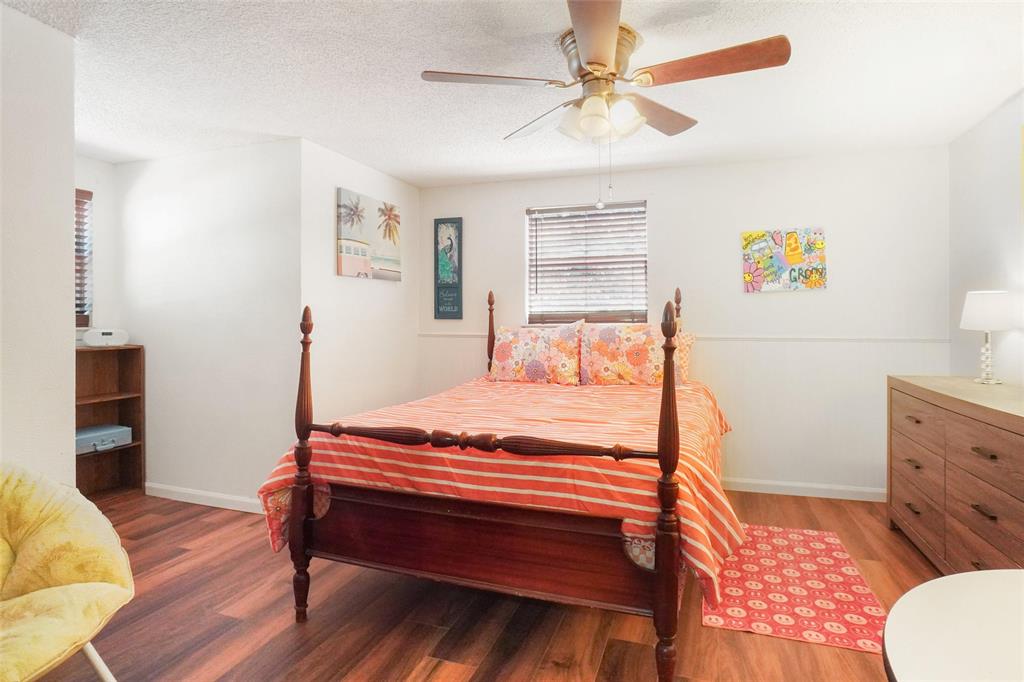 3200 Farm To Market 51 Decatur, TX 76234 - Photo 13 of 22 a bedroom with a bed and a chandelier