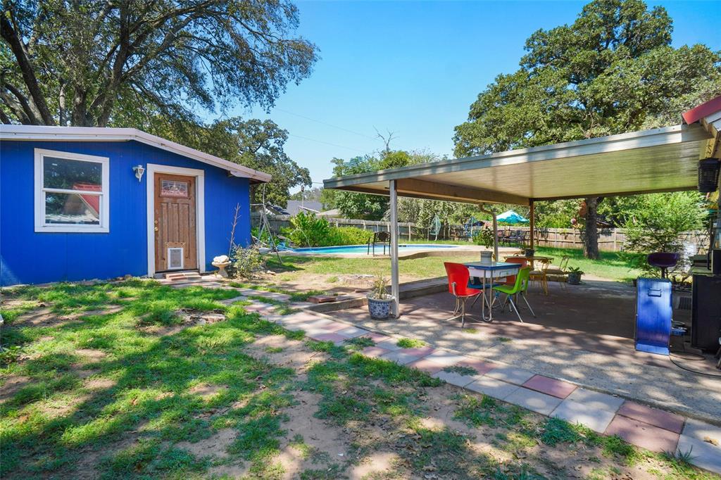 3200 Farm To Market 51 Decatur, TX 76234 - Photo 16 of 22 a view of a backyard with table and chairs under an umbrella