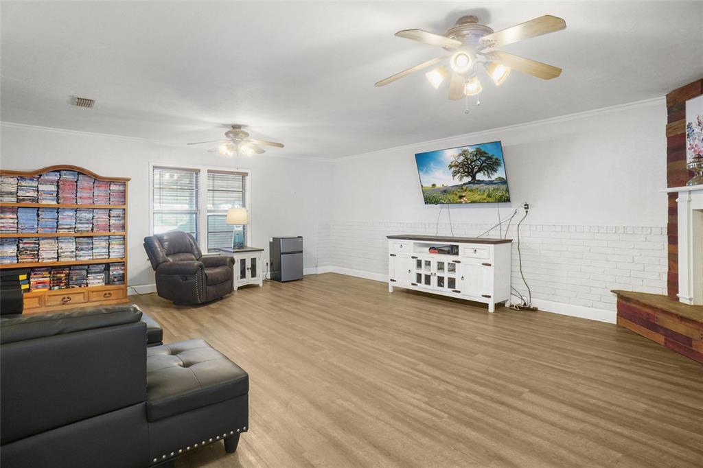 3200 Farm To Market 51 Decatur, TX 76234 - Photo 3 of 22 a spacious bedroom with a bed a couch and a chandelier