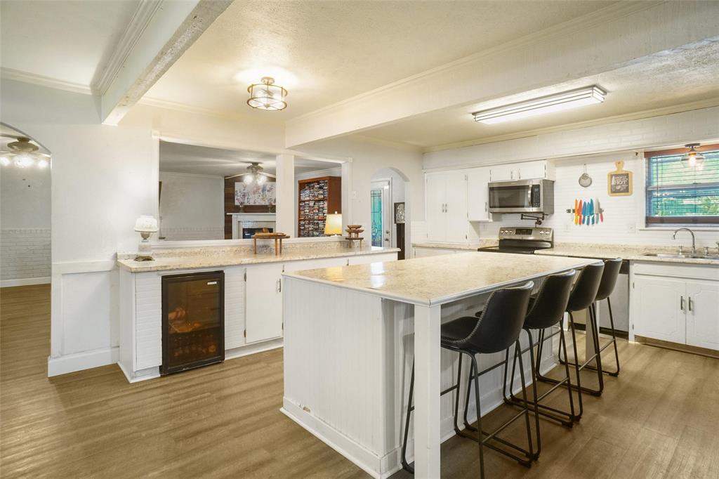3200 Farm To Market 51 Decatur, TX 76234 - Photo 6 of 22 a kitchen with a table chairs sink and cabinets