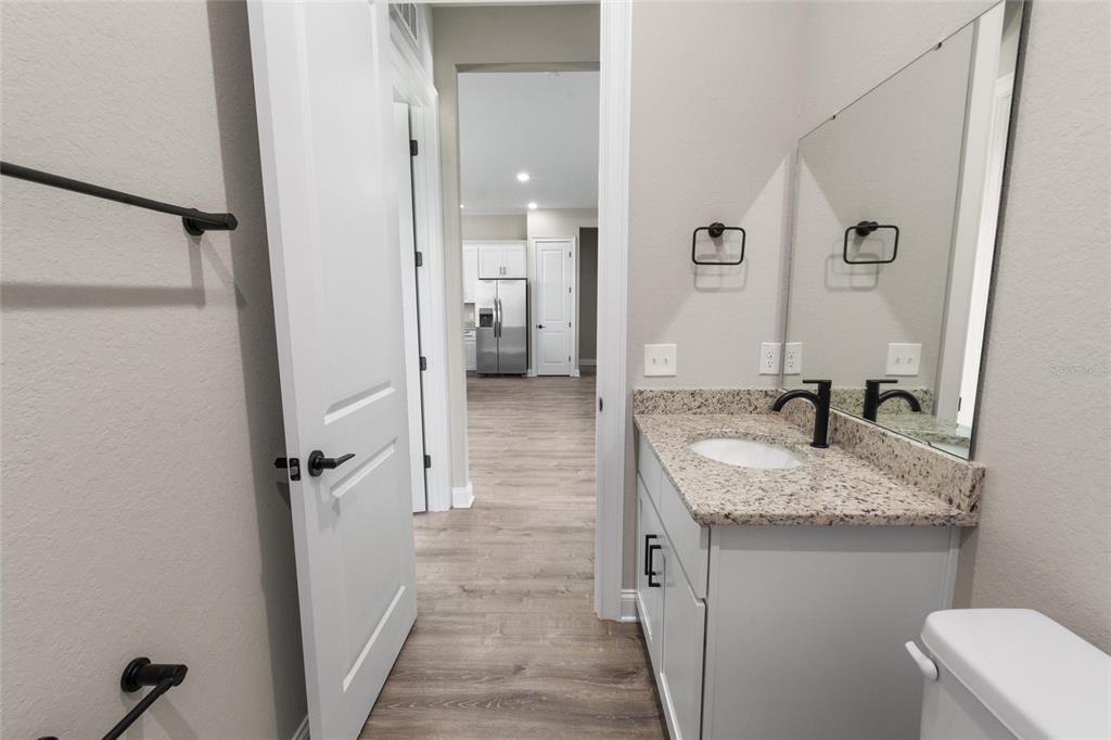 3620 Garrard Road Fort Meade, FL 33841 - Photo 15 of 33 a bathroom with a granite countertop sink mirror and shower