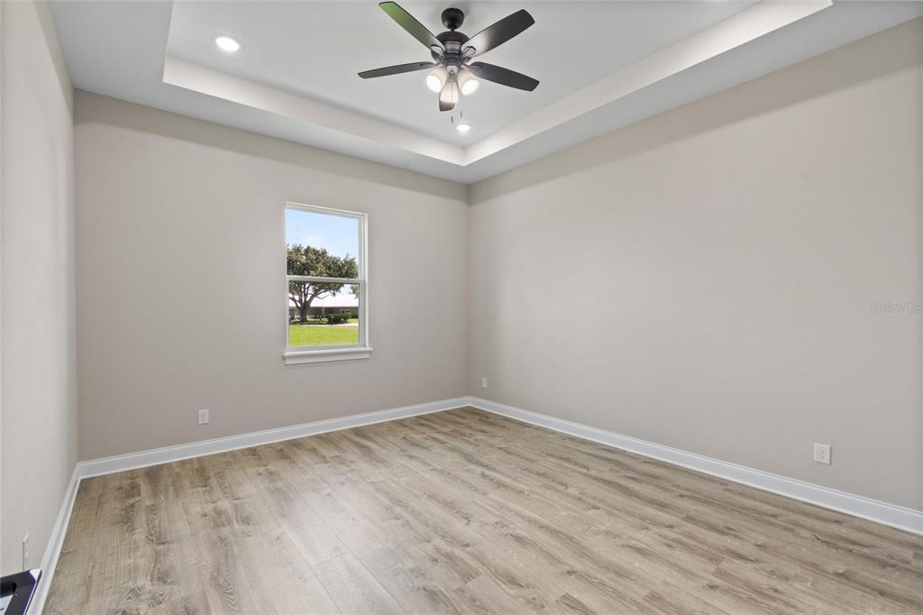 3620 Garrard Road Fort Meade, FL 33841 - Photo 20 of 33 an empty room with a window and ceiling fan