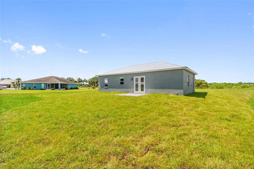 3620 Garrard Road Fort Meade, FL 33841 - Photo 33 of 33 a front view of house with yard and ocean view