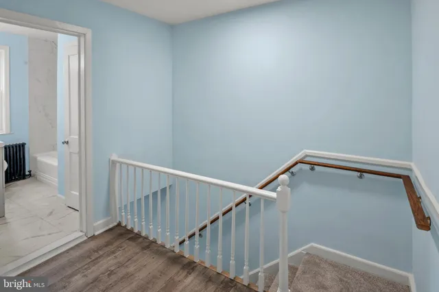 a view of entryway with wooden floor
