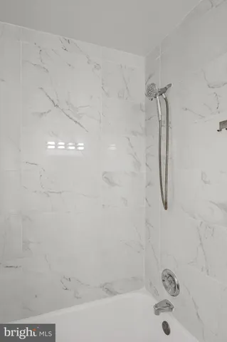 a bathroom with a bath tub