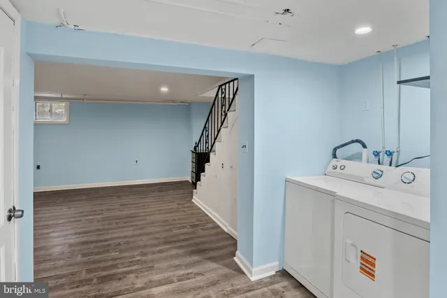 a view of an empty room with stairs and stairs