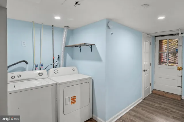 a view of a hallway with washer and dryer