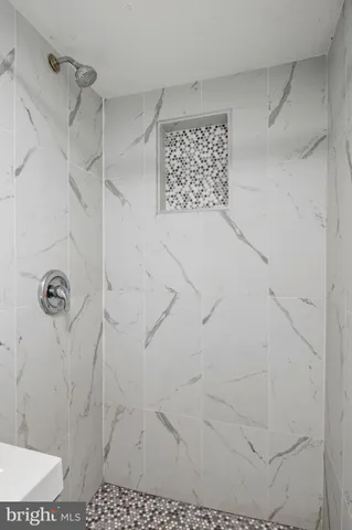 a bathroom with a sink toilet and a mirror