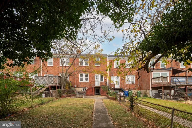 a front view of a building with outdoor seating