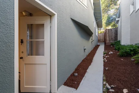 a view of a very nice looking dining room with a table and chairs