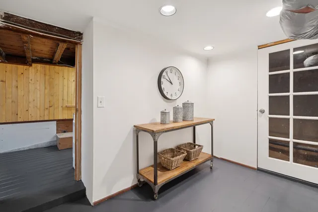 a view of a house with yard and sitting area