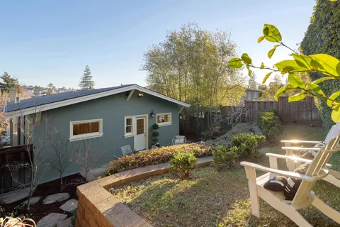 a front view of a house with garden