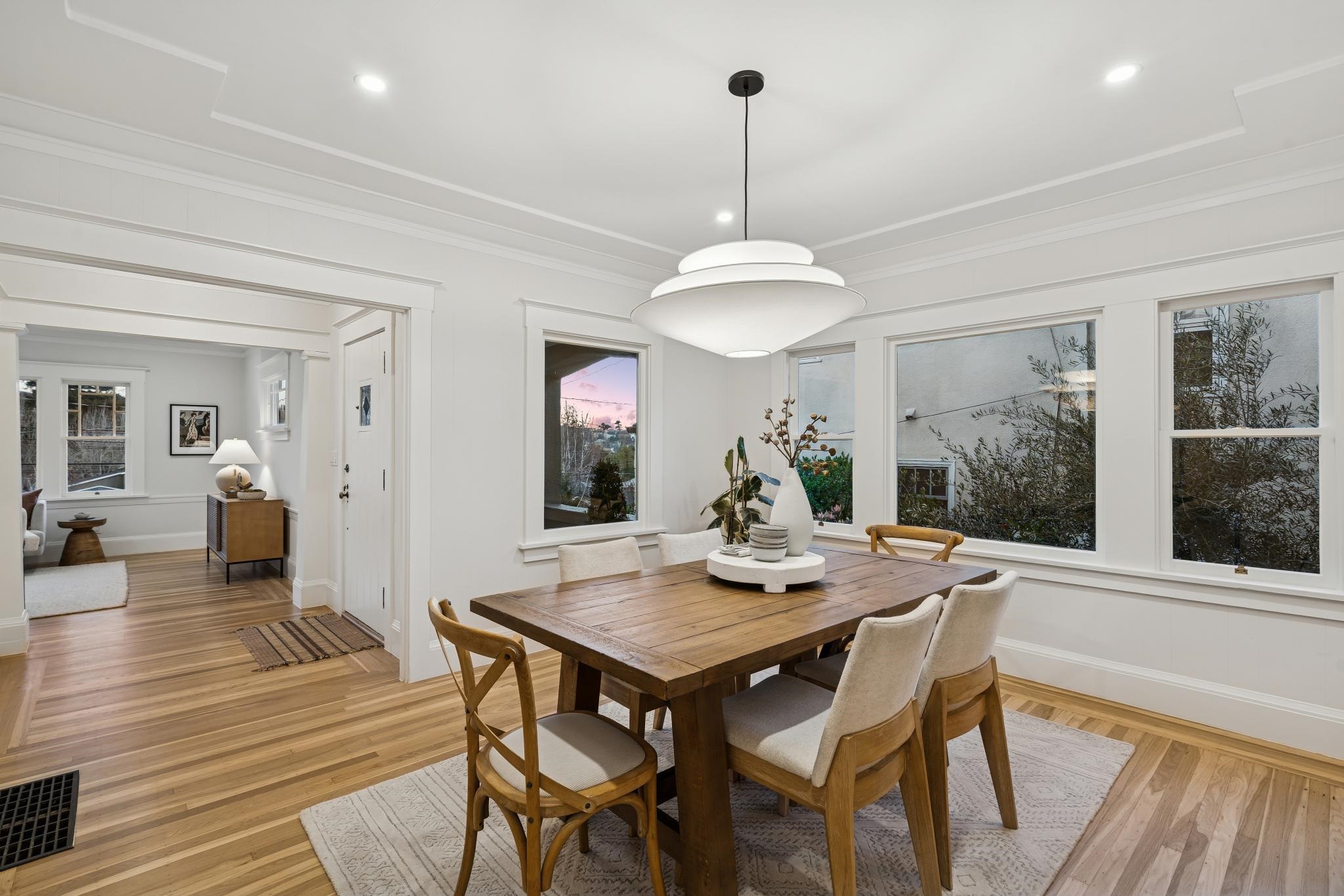 1117 Ranleigh Way Piedmont, CA 94610 - Photo 35 of 45 a view of a dining room and livingroom with furniture wooden floor a chandelier