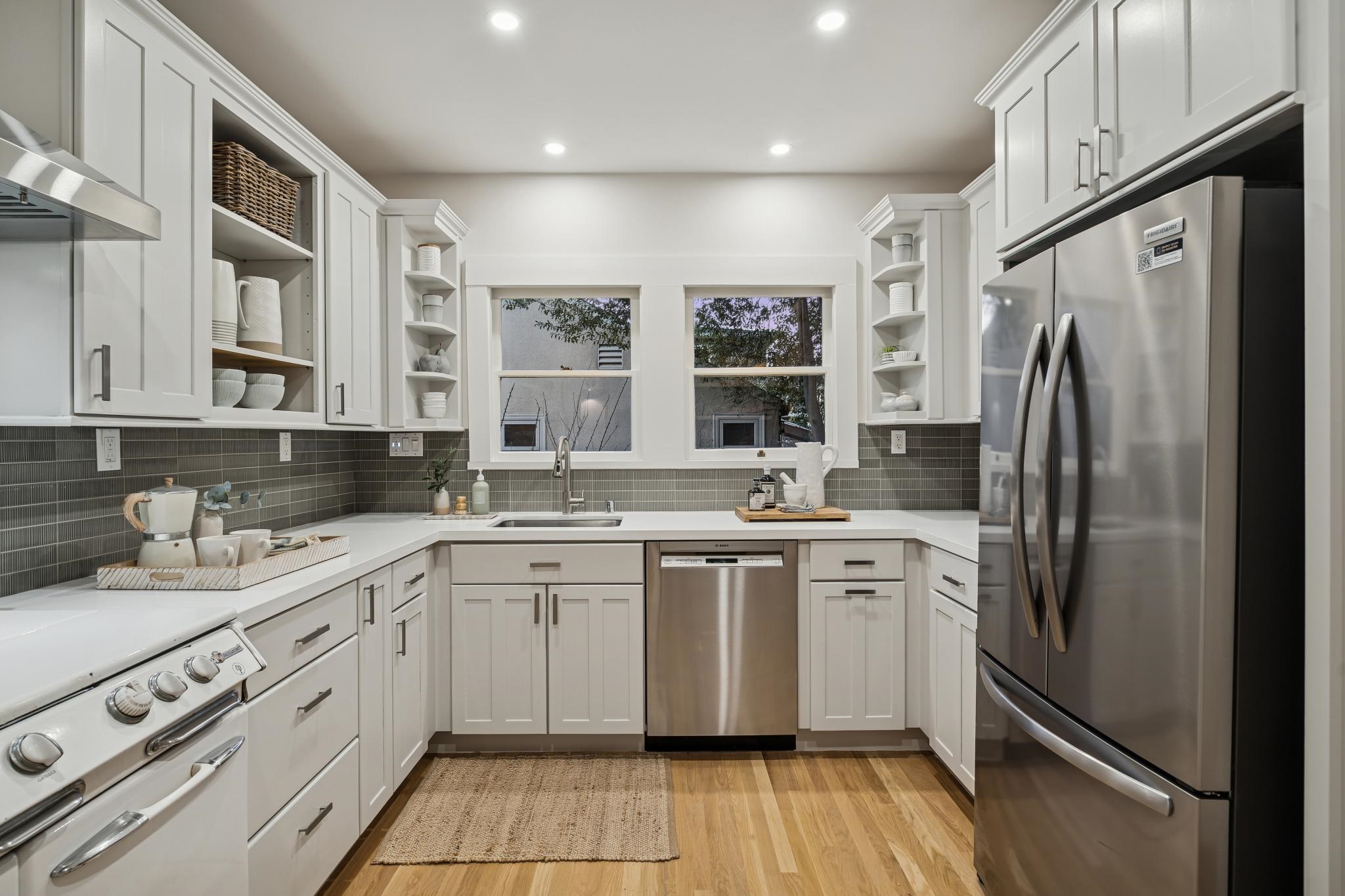 1117 Ranleigh Way Piedmont, CA 94610 - Photo 36 of 45 a kitchen with stainless steel appliances granite countertop a refrigerator sink and cabinets