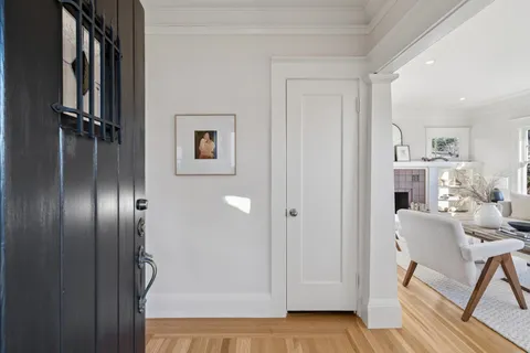 a view of a livingroom with furniture and front door