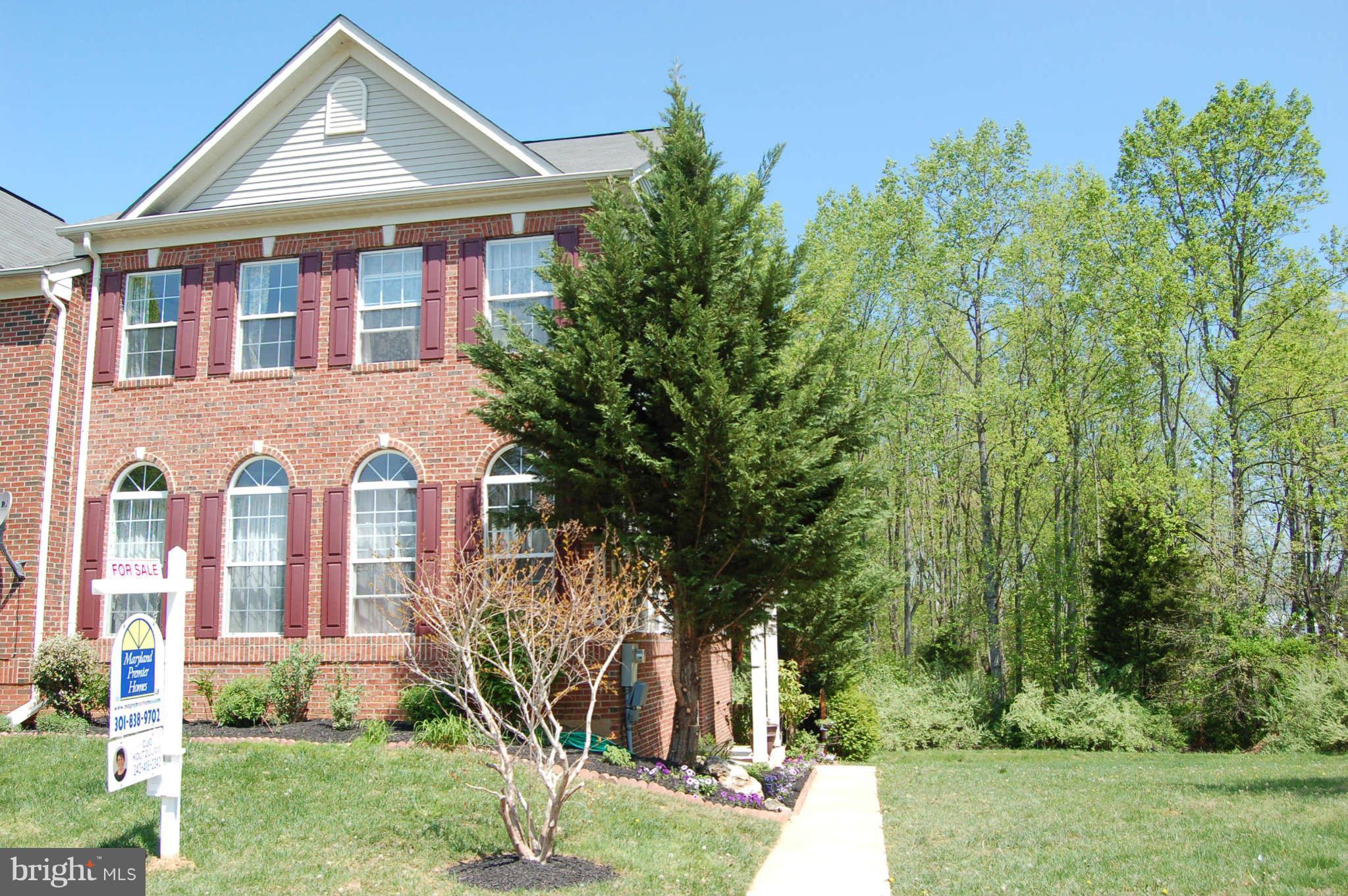 18812 Broken Oak Road Boyds, MD 20841 - Photo 2 of 30 a front view of a house with garden