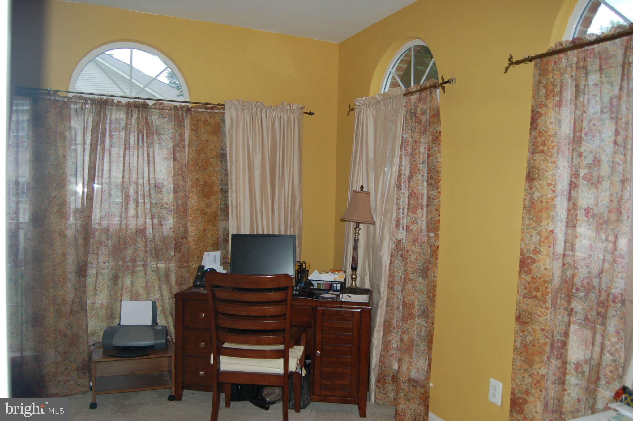 18812 Broken Oak Road Boyds, MD 20841 - Photo 12 of 30 a view of a bathroom with a mirror and a shower curtain