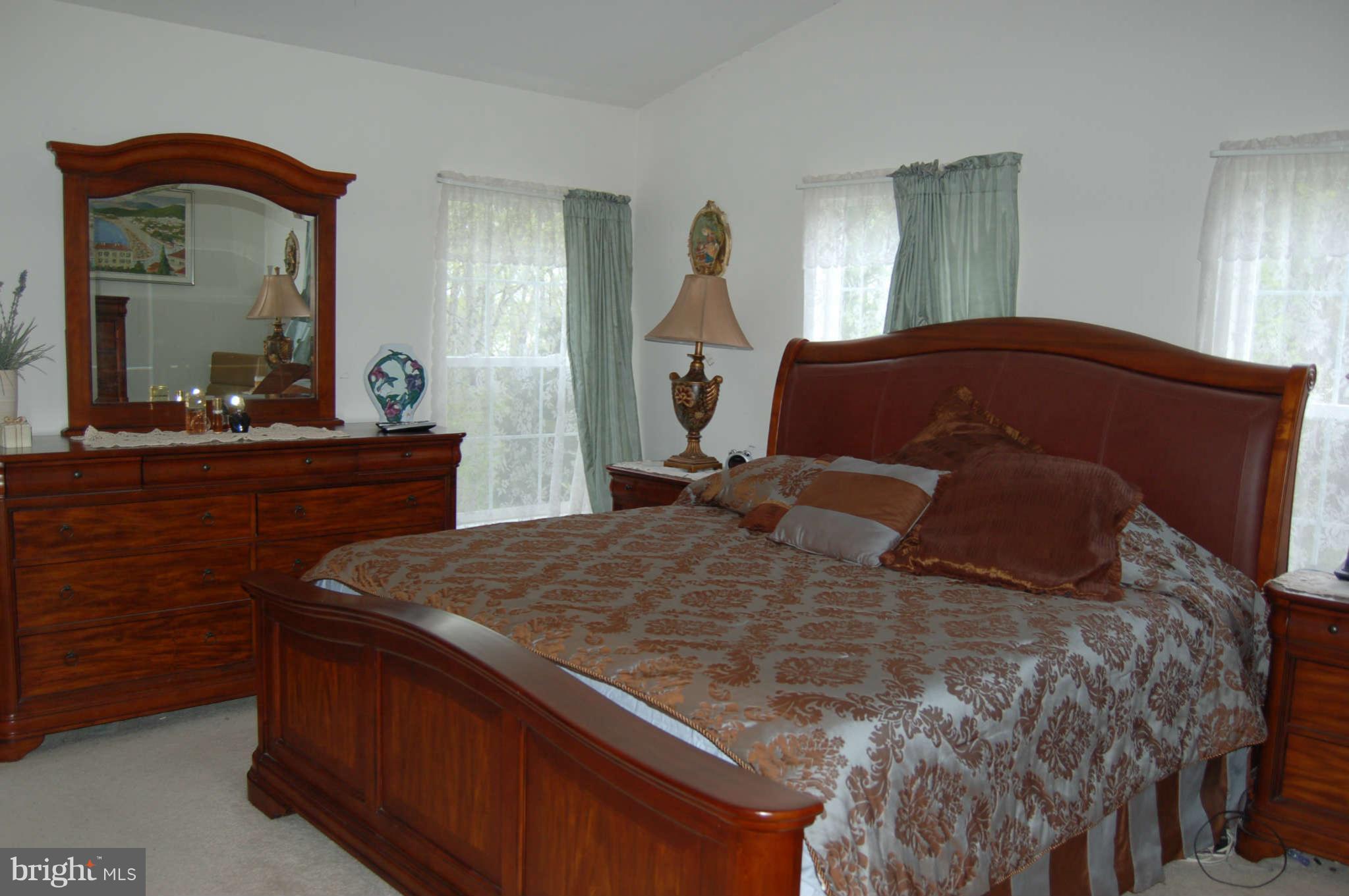 18812 Broken Oak Road Boyds, MD 20841 - Photo 14 of 30 a bedroom with a bed and a dresser