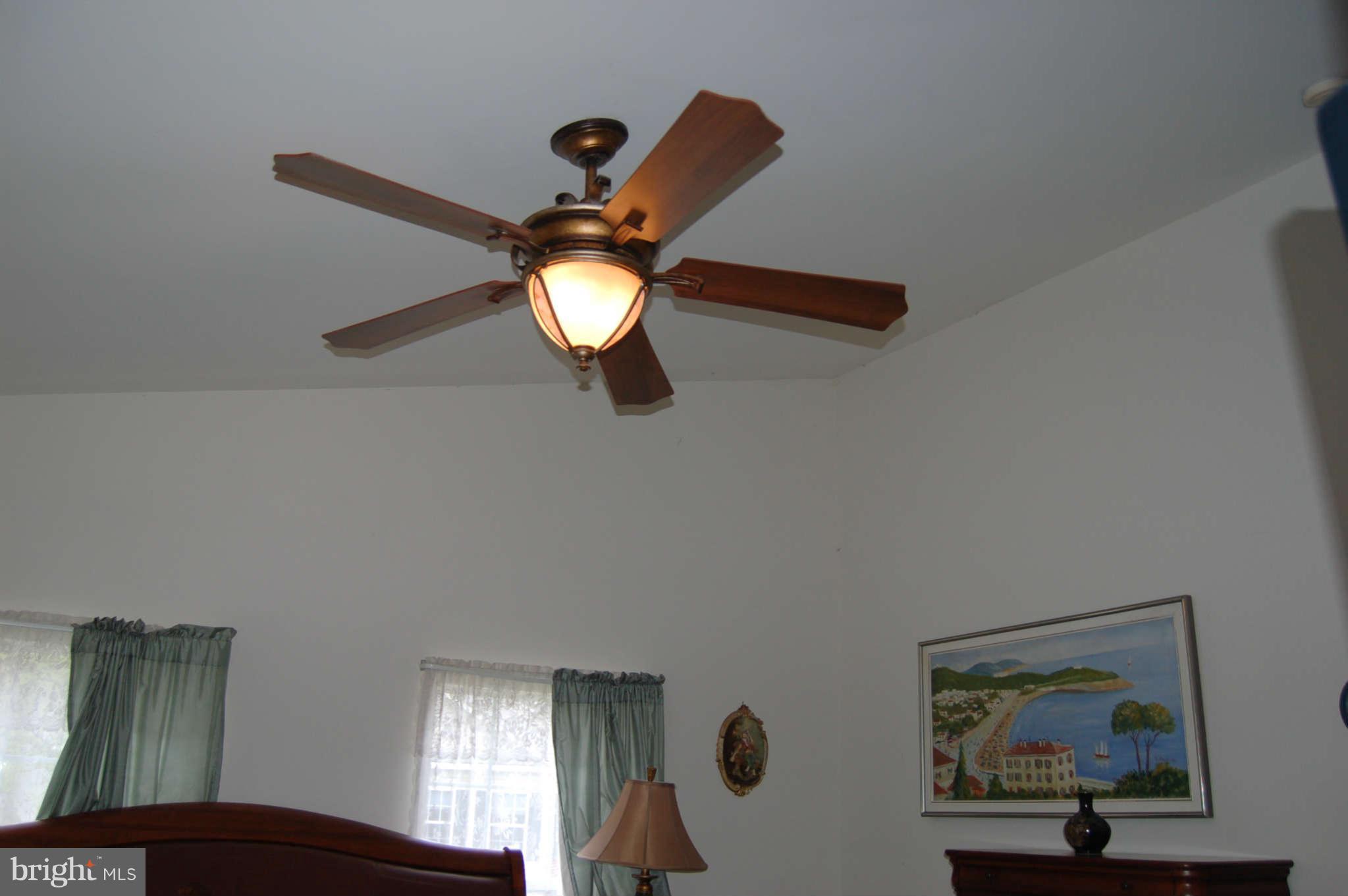 18812 Broken Oak Road Boyds, MD 20841 - Photo 15 of 30 a view of a livingroom with furniture and chandelier fan