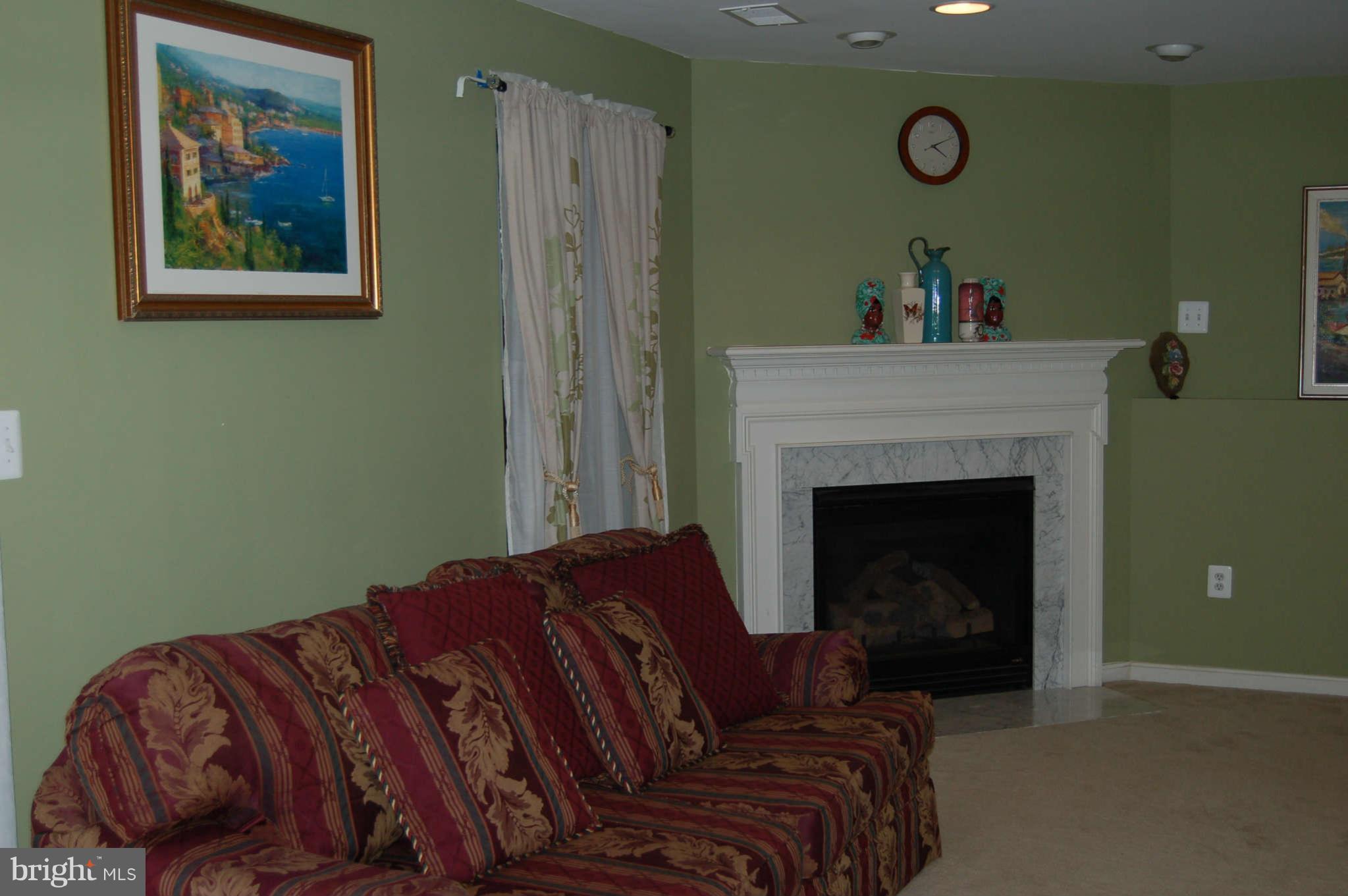 18812 Broken Oak Road Boyds, MD 20841 - Photo 24 of 30 a bedroom with a bed and a fireplace