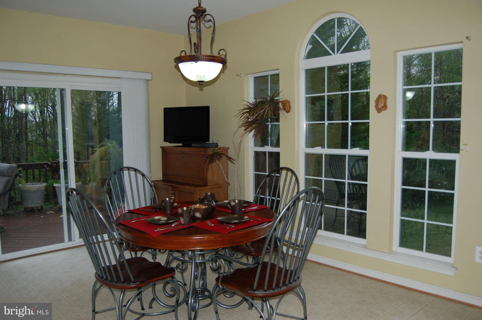 18812 Broken Oak Road Boyds, MD 20841 - Photo 6 of 30 a view of a dining room with furniture window and outside view