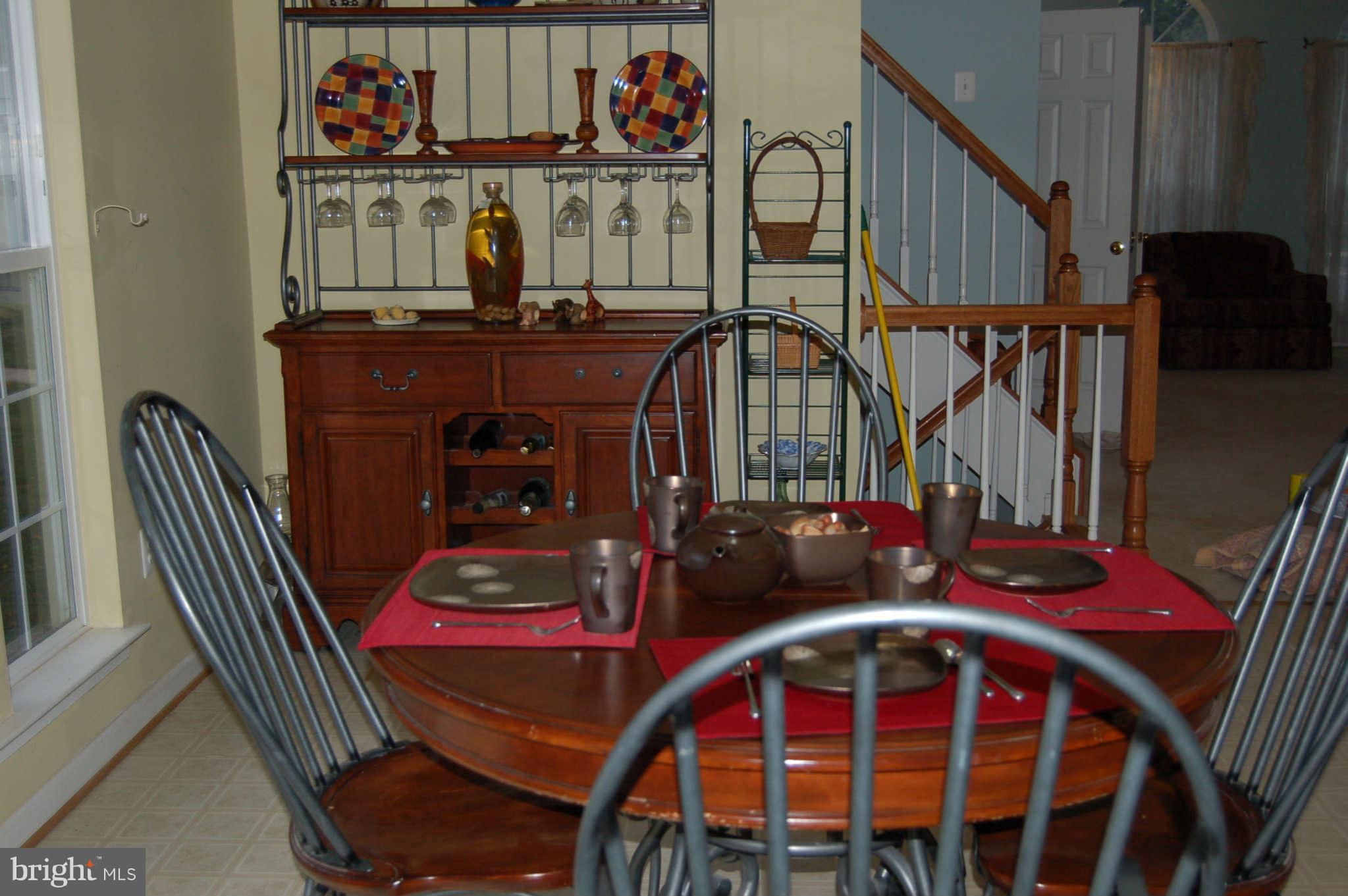 18812 Broken Oak Road Boyds, MD 20841 - Photo 7 of 30 a view of a balcony with furniture and wooden floor