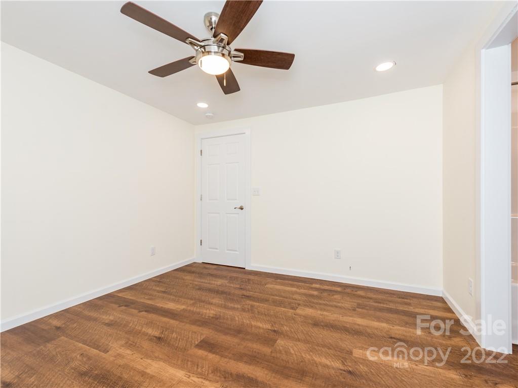 16 Jaffe Road Rosman, NC 28772 - Photo 19 of 20 an empty room with a fan and a ceiling fan