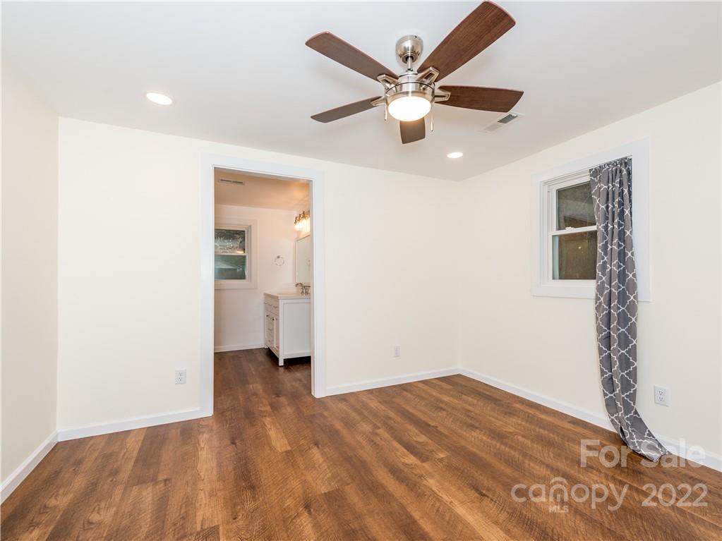 16 Jaffe Road Rosman, NC 28772 - Photo 20 of 20 a view of a big room with wooden floor and a ceiling fan
