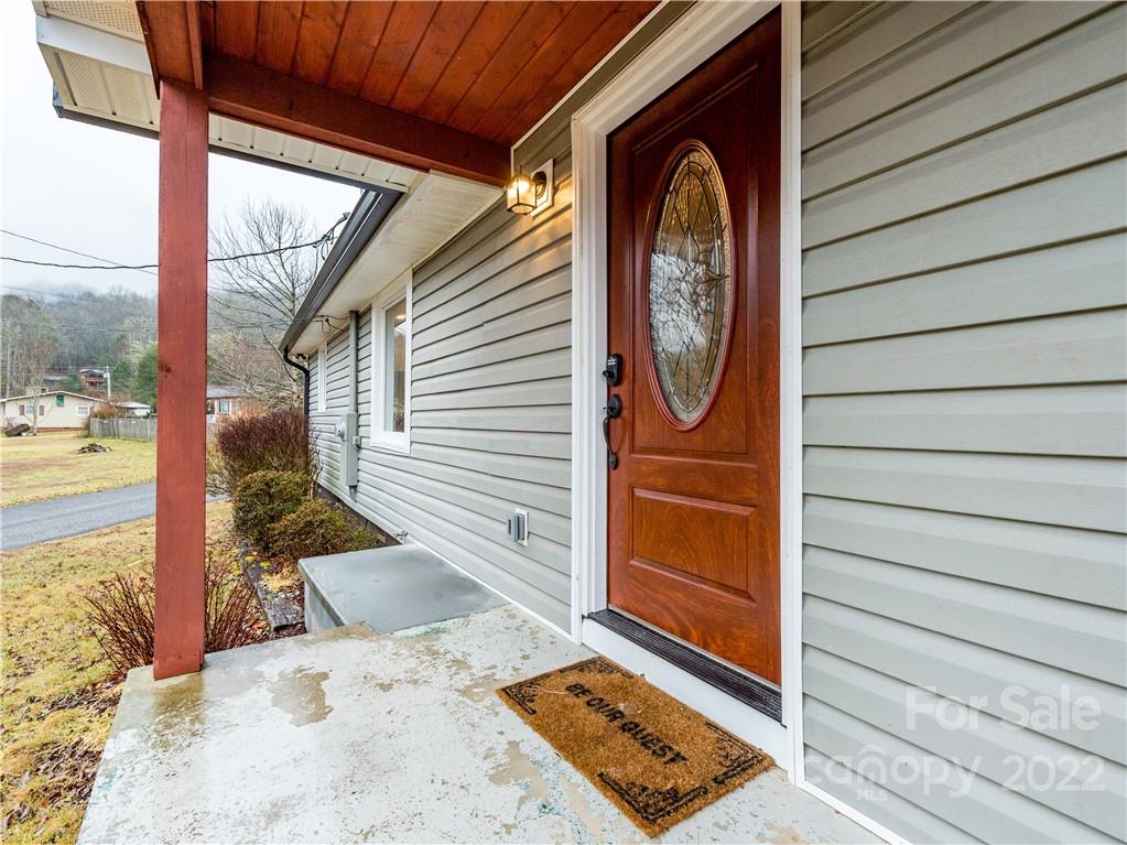 16 Jaffe Road Rosman, NC 28772 - Photo 5 of 20 a view of a door of the house with a patio