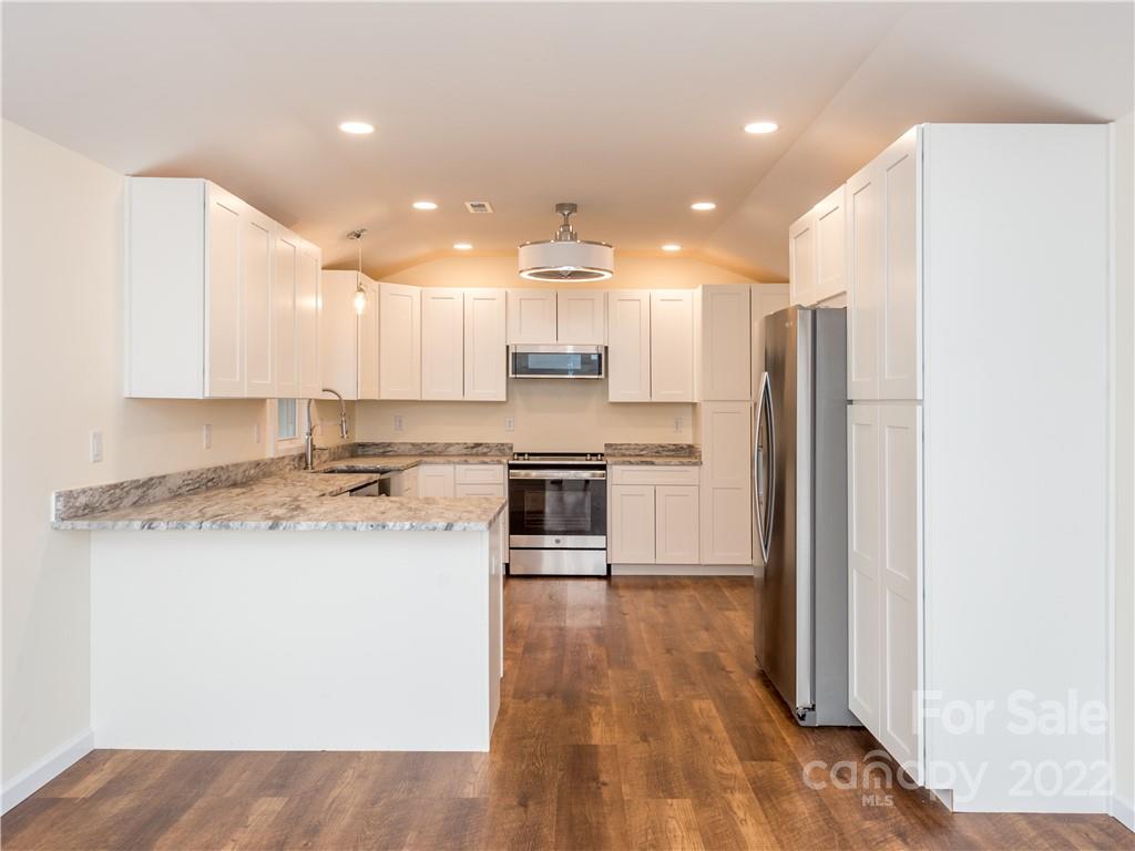 16 Jaffe Road Rosman, NC 28772 - Photo 6 of 20 a kitchen with a refrigerator a sink and a microwave