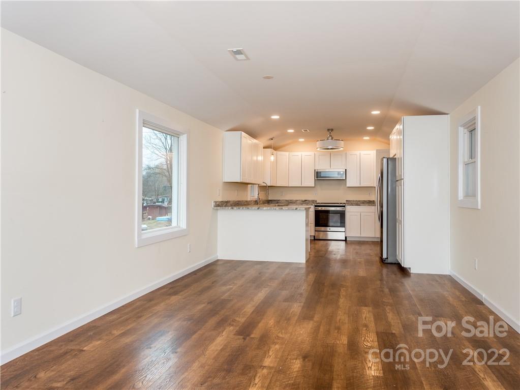 16 Jaffe Road Rosman, NC 28772 - Photo 10 of 20 a view of kitchen with wooden floor and a window