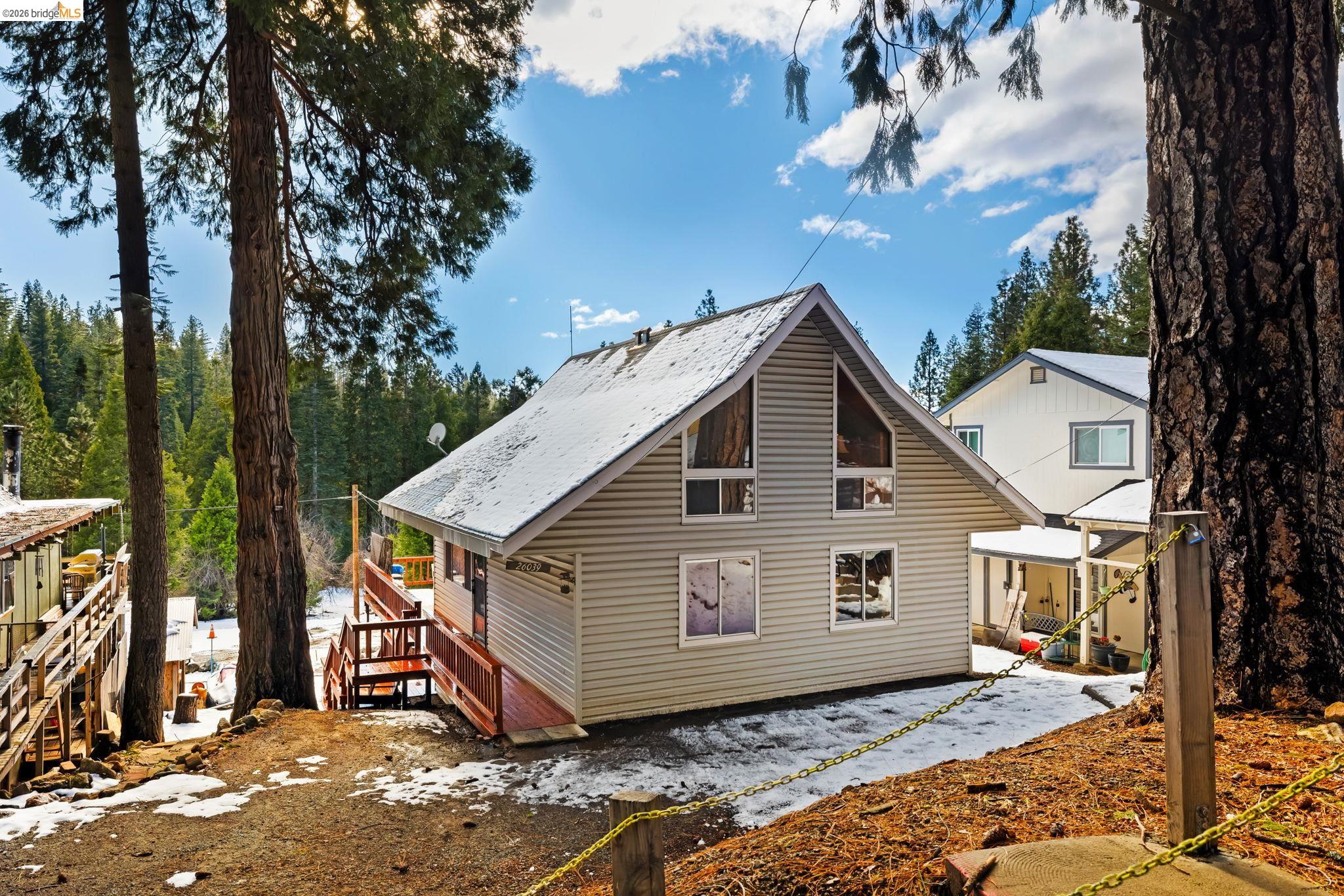 Rear view of property with a wooden deck