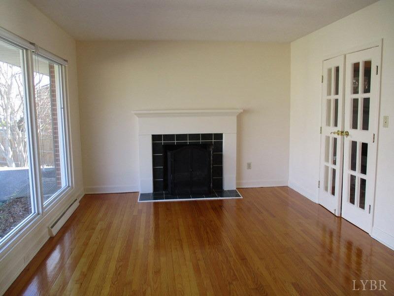 537 Jasper Wood Road Hurt, VA 24563 - Photo 3 of 39 a view of an empty room with wooden floor and a window