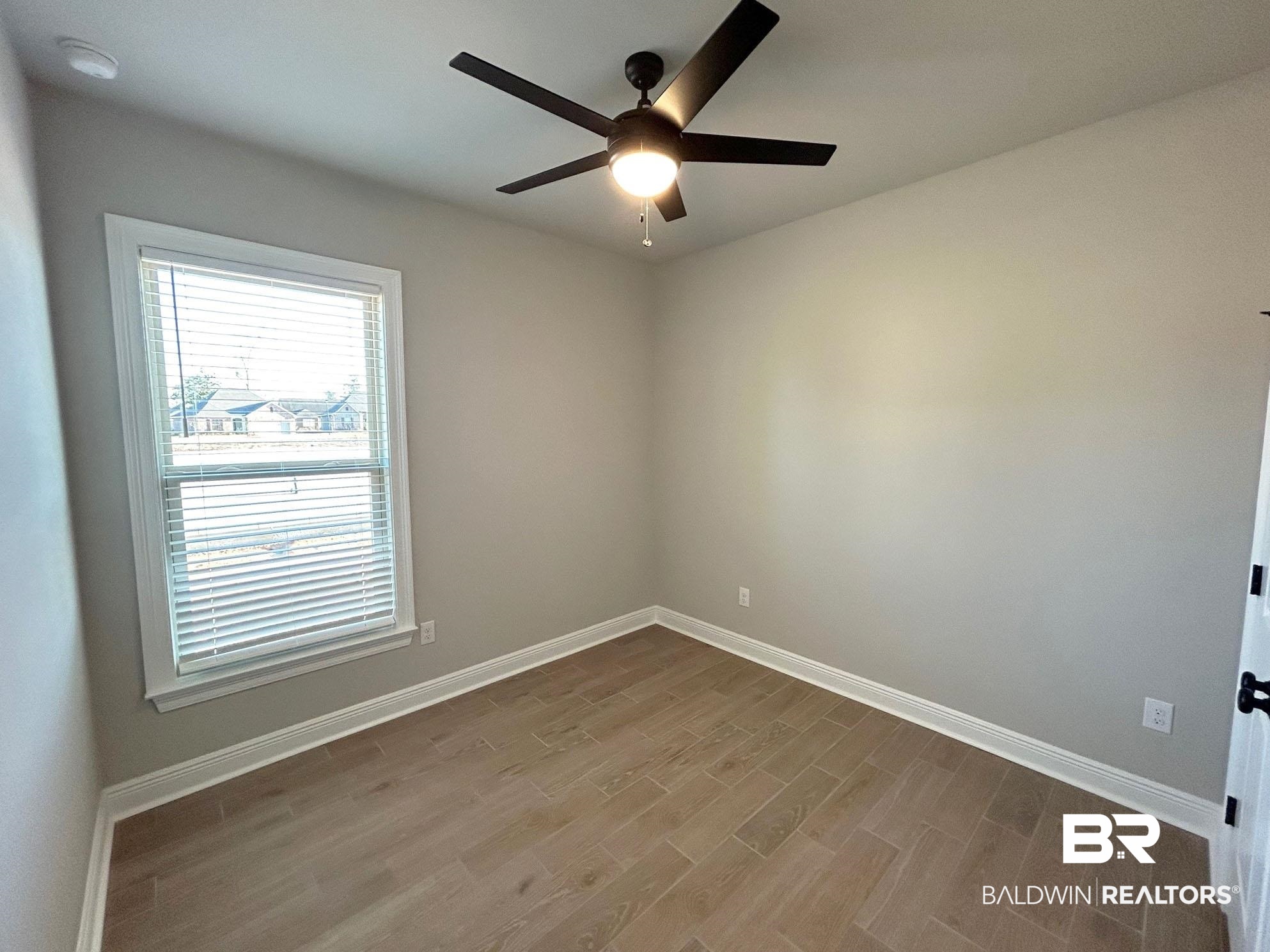 813 Sumter Loop Foley, AL 36535 - Photo 13 of 18 Unfurnished room featuring light wood-type flooring and ceiling fan