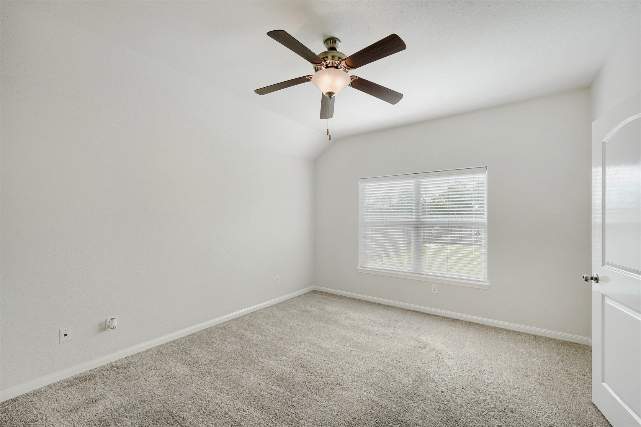 13408 Clara Martin Road Manor, TX 78653 - Photo 14 of 27 an empty room with ceiling fan and windows