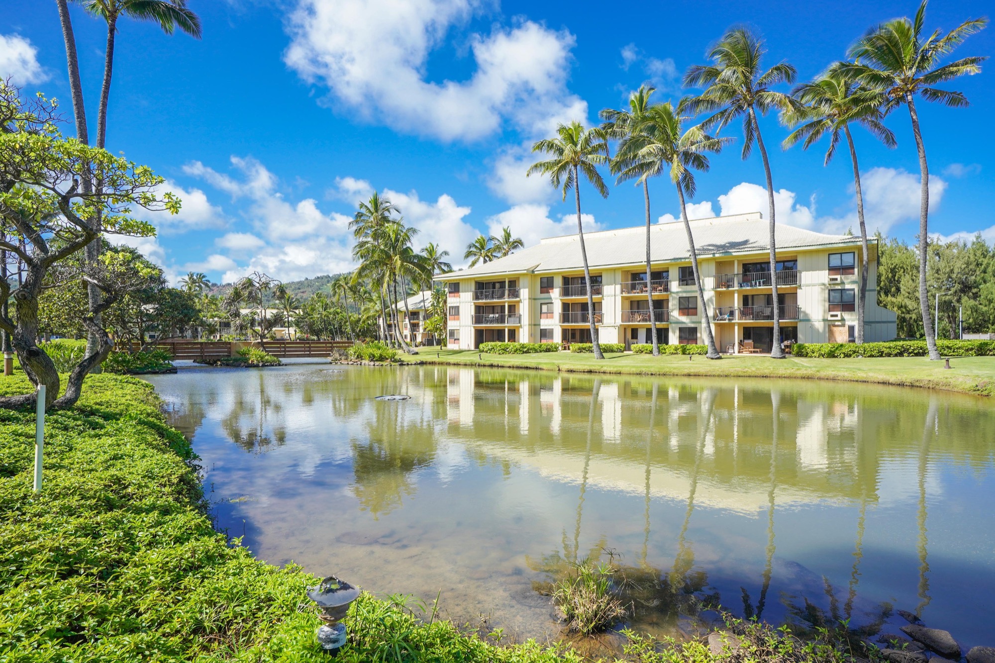 4330 Kauai Beach Drive, Unit E13 Lihue, HI 96766 - Photo 15 of 30 a view of a lake with a building in the background