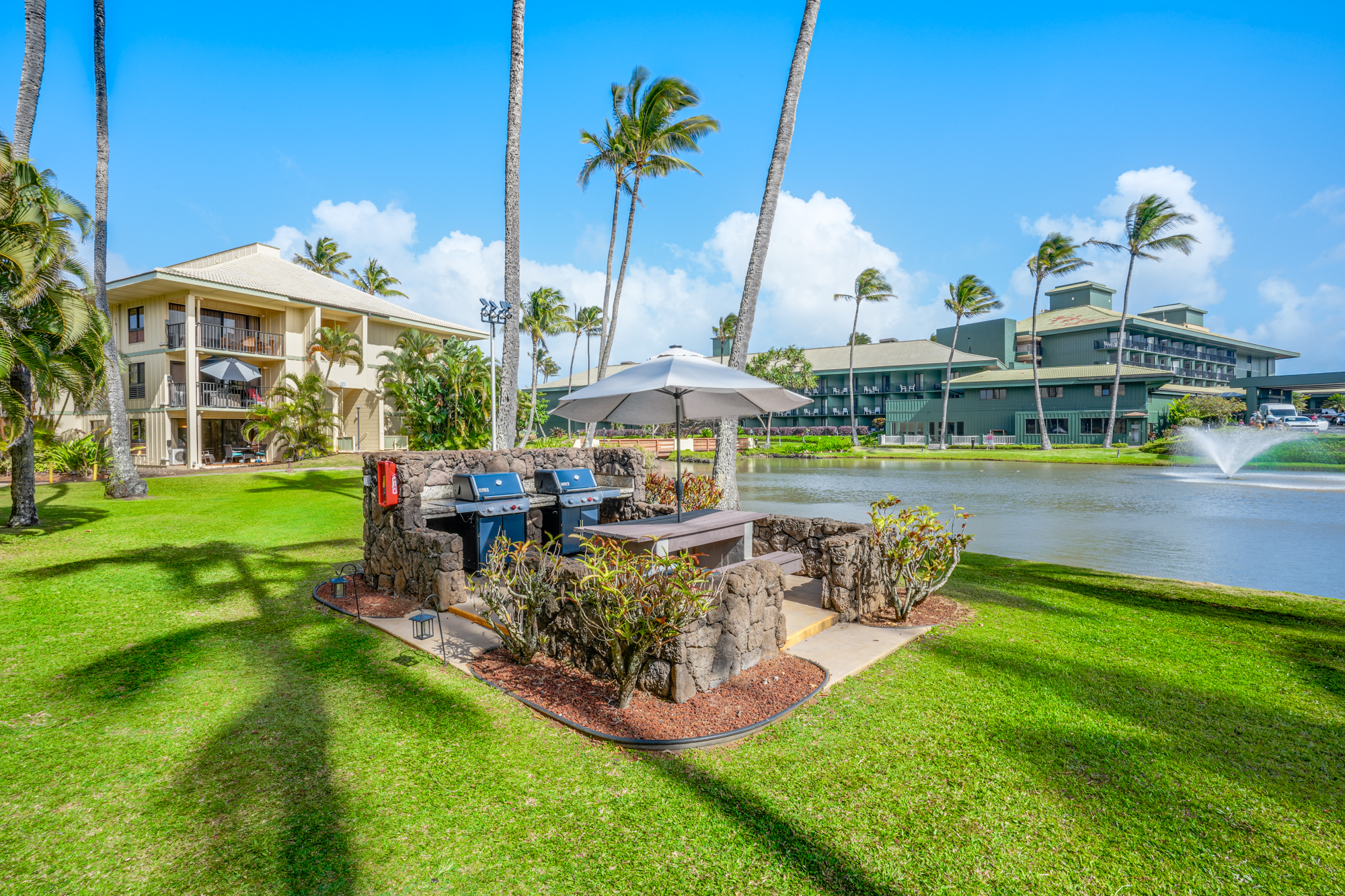 4330 Kauai Beach Drive, Unit E13 Lihue, HI 96766 - Photo 20 of 30 a view of a house with swimming pool and sitting area