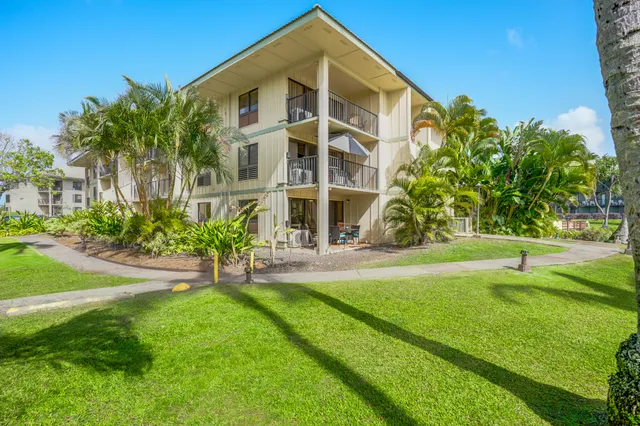 a view of backyard with swimming pool and outdoor seating