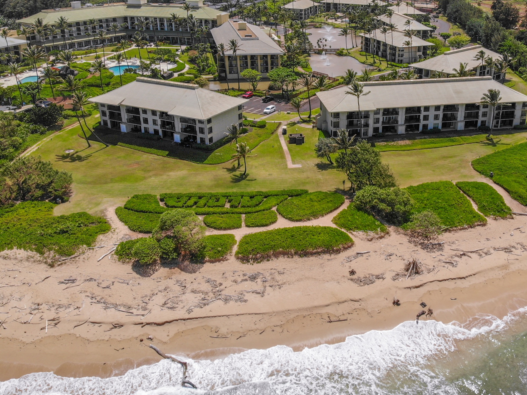 4330 Kauai Beach Drive, Unit E13 Lihue, HI 96766 - Photo 29 of 30 a aerial view of a house with a swimming pool